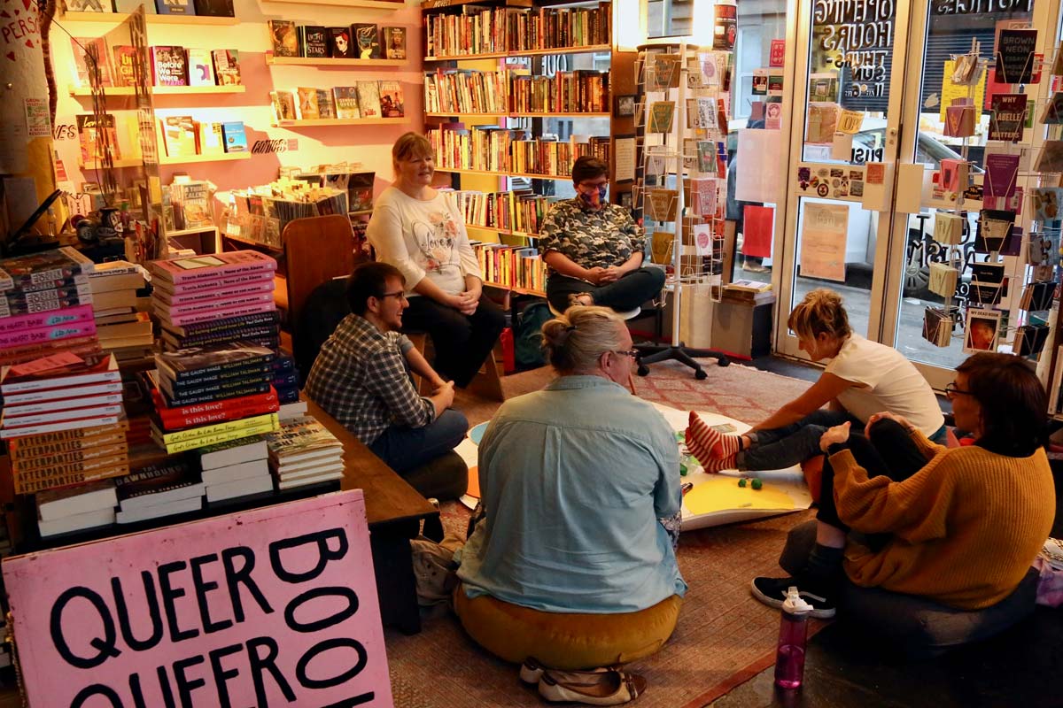 photograph of people in queer bookshop drawing